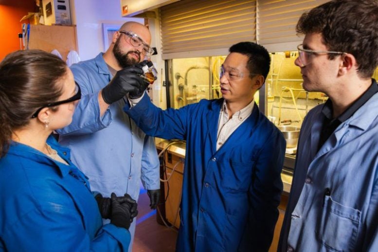 Guoliang Liu, Connor Thompson, Abby Civrello, and Adrian DiMarco Examine Samples of Engine Oil