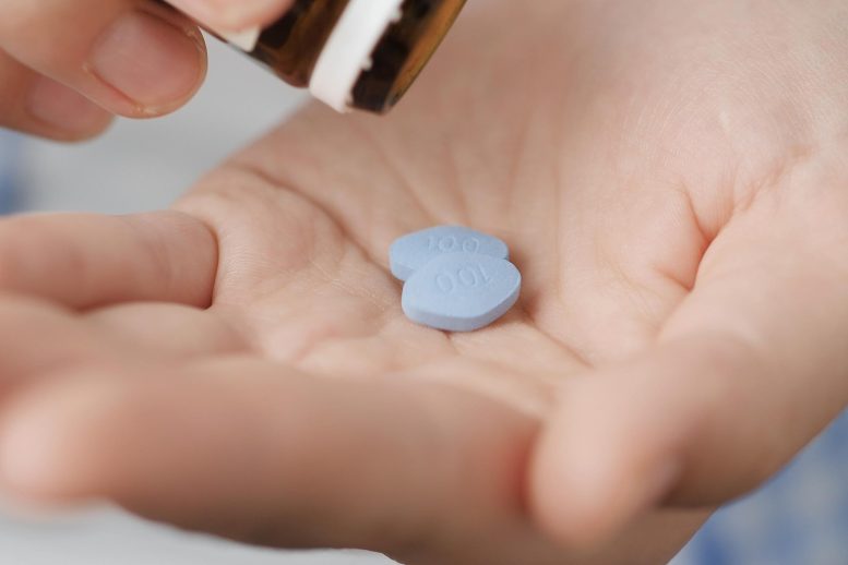 Hand Holding Viagra Two Blue Diamond Pills