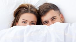 Happy Couple in Bed
