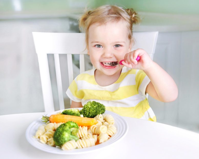 Happy Girl Kid Eating Vegetables