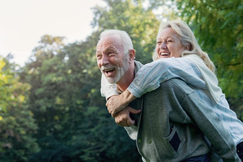 Happy Senior Couple Playing Outdoors Nature