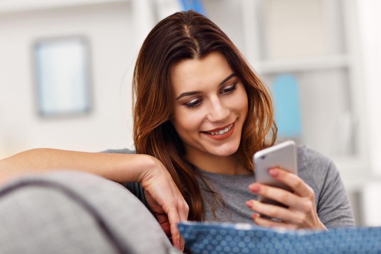 Happy Woman Using Cell Phone