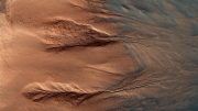 HiRISE Views Contrasting Colors of Crater Dunes and Gullies on Mars