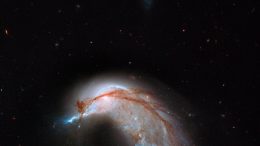 Hubble Captures Collision Between a Spiral and an Elliptical Galaxy