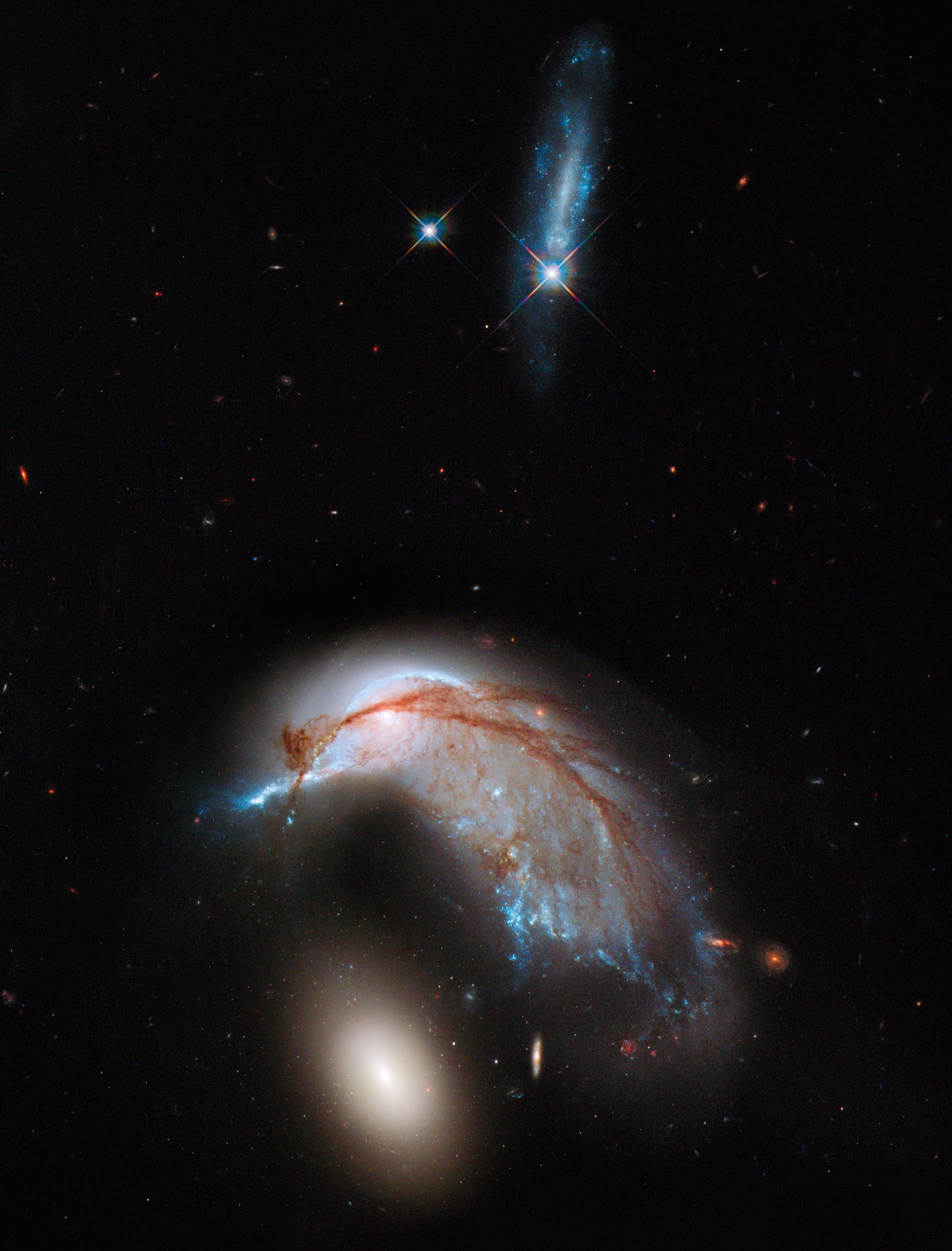 Hubble Views Interacting Galaxy Duo Arp 142