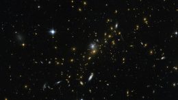 Hubble Uses Gravitational Lensing to View Distant Galaxy Clusters