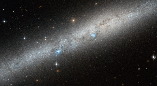 Hubble Views Blue Bursts of Hot Young Stars