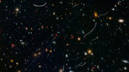Hubble Views Nearby Asteroids Photobombing Distant Galaxies