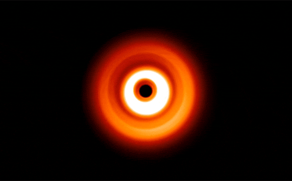 Hubble Views 'Shadow Play' Caused by Possible Planet