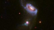 Hubble Views Supermassive Black Hole Blowing Huge Bubbles