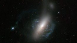 Hubble Views an Ongoing Cosmic Collision between Two Galaxies