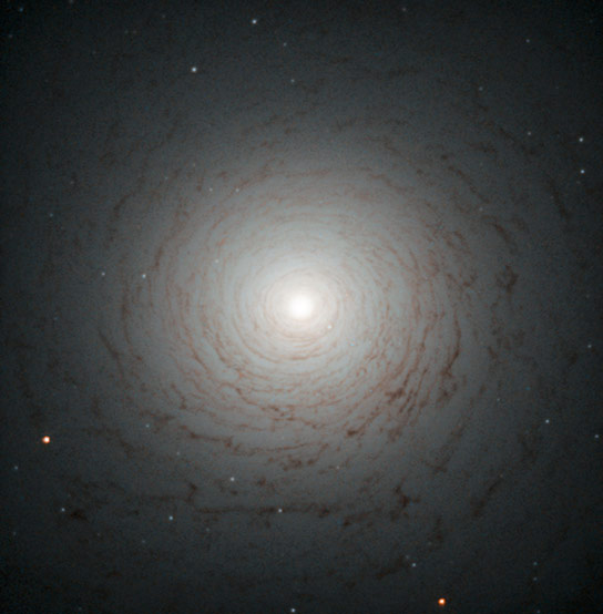 Hubble Views the Mysterious Spiral of NGC 524