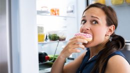 Hungry Woman Eating Donut
