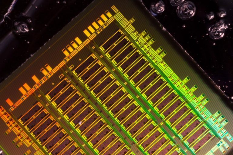 Integrating Photonics with Silicon Nanoelectronics Into Chip Designs