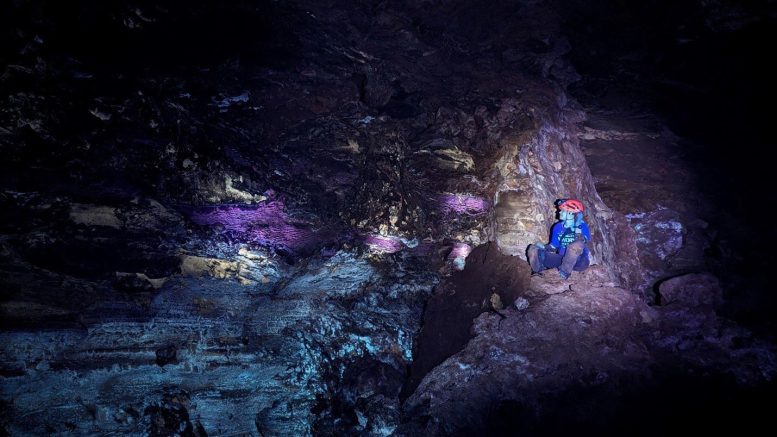 Jacqueline Heggen, Showing Off Glowing Formations Within Wind Cave
