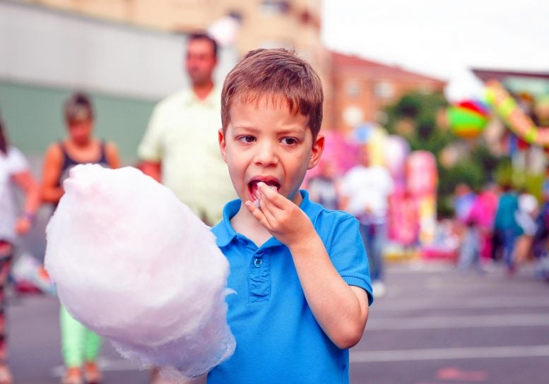 Kid Eating Cotton Candy