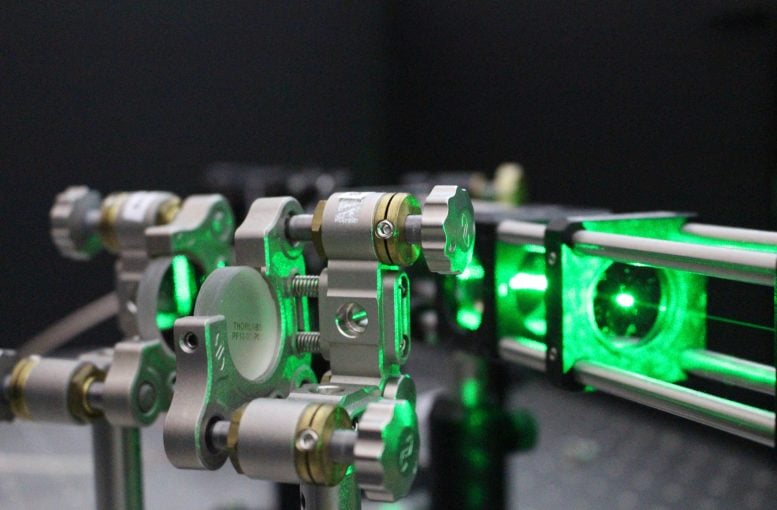 The laser beam probes the quantum properties of diamond