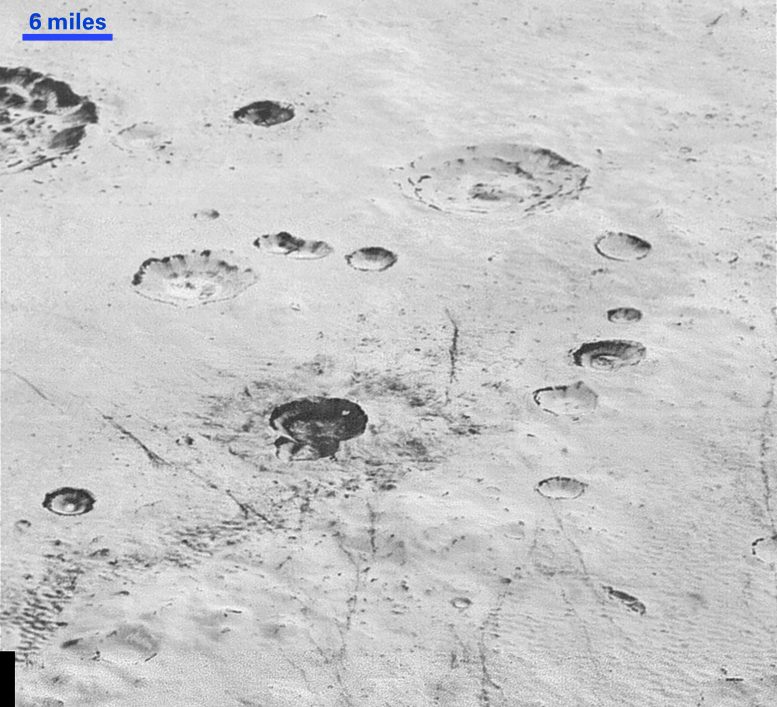 Layered Craters and Icy Plains on Pluto
