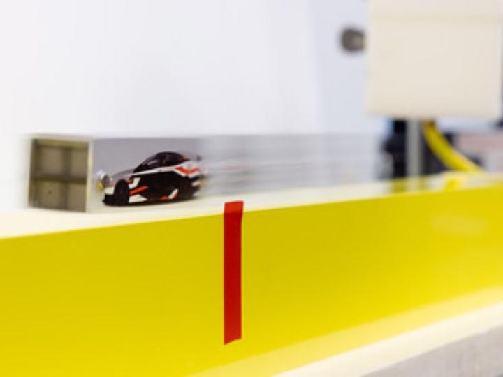 Levitated Model Car Zooming Over Superconducting Guideway