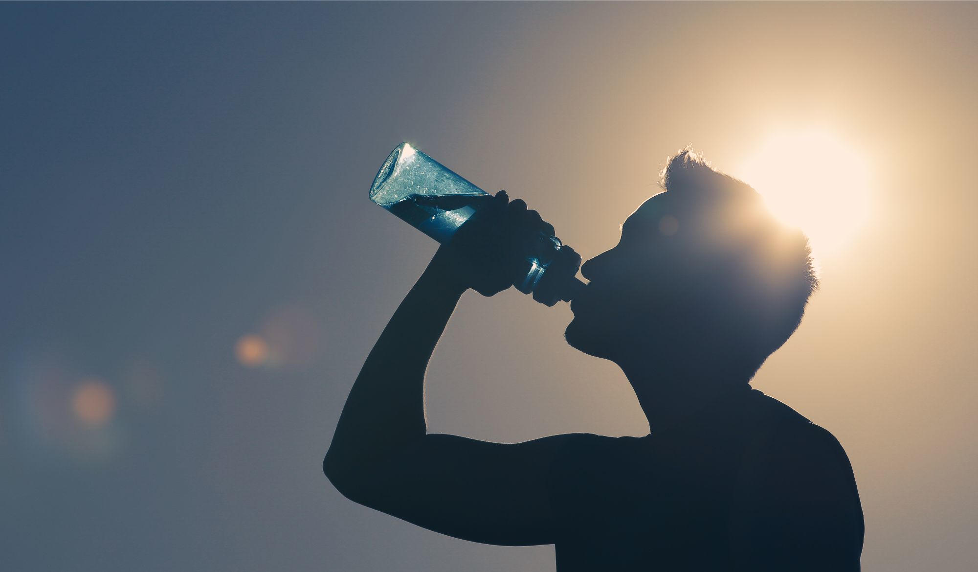 Man Drinking Water Outside