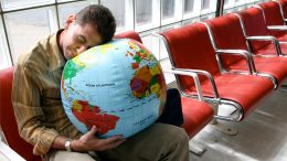 Man Sleeping Airport Globe