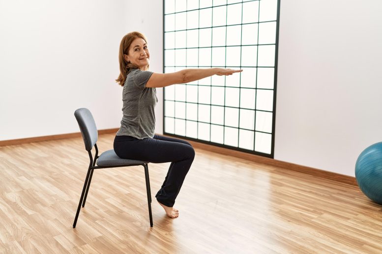 Middle Age Woman Chair Exercise