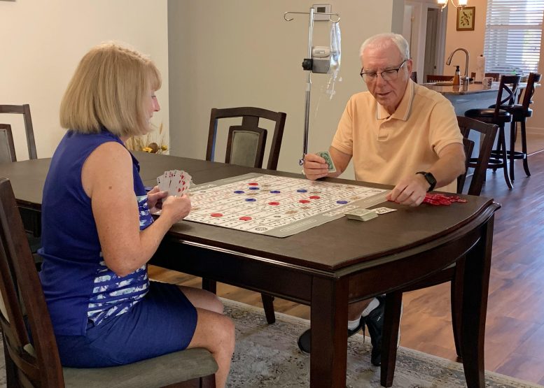 Mike Sail Plays a Board Game With His Wife Ann