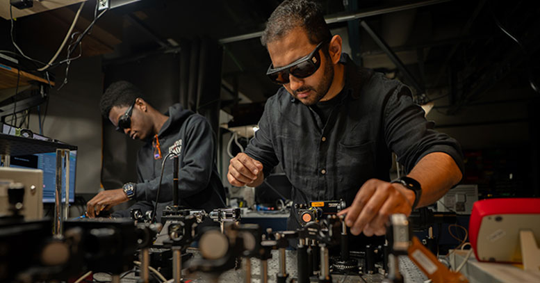 Muhammad Waleed Khalid and Koffi Sadzi Adjust Optics