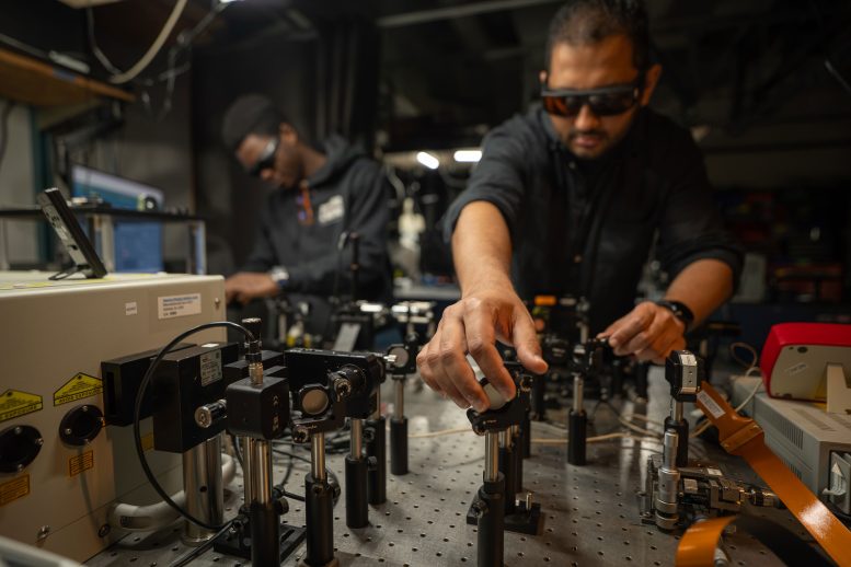 Muhammad Waleed Khalid and Koffi Sadzi Work at Optical Bench