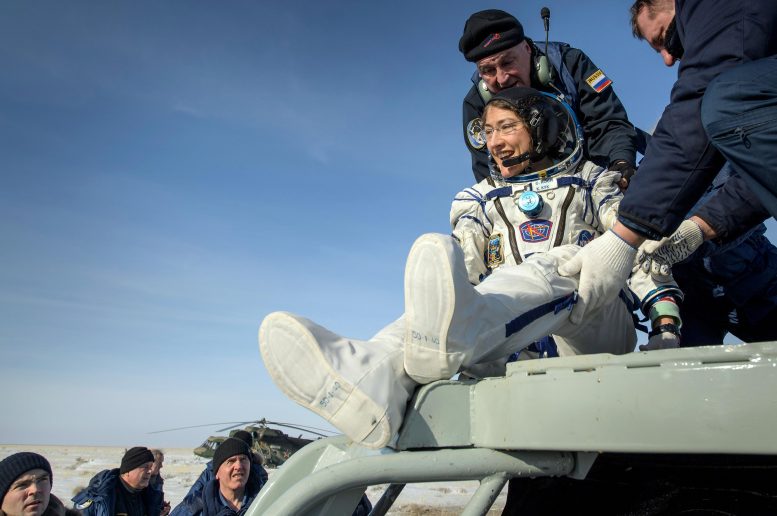 NASA Astronaut Christina Koch Is Helped Out of the Soyuz MS-13 Spacecraft