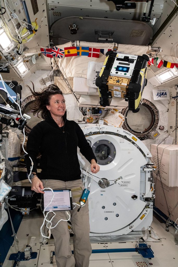 NASA Astronaut Megan McArthur Observes Astrobee Robot Honey