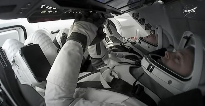 NASA Astronaut Nick Hague and Roscosmos Cosmonaut Aleksandr Gorbunov Inside SpaceX Dragon Capsule