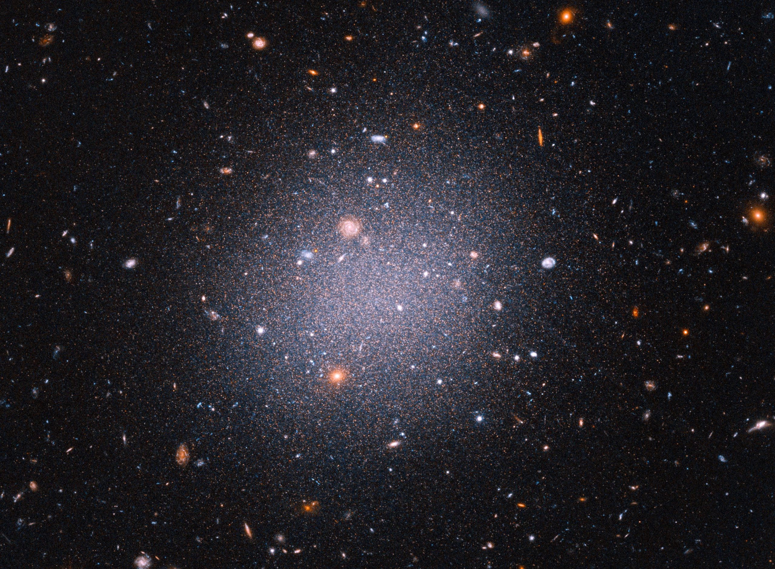 Giant Cosmic Cotton Ball: A Dark Matter Deficient Galaxy