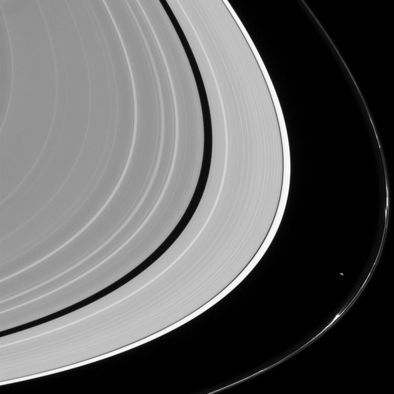 New Cassini Image of Prometheus and Saturn's Rings