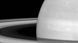 New Cassini Image of Tiny Mimas Huge Rings