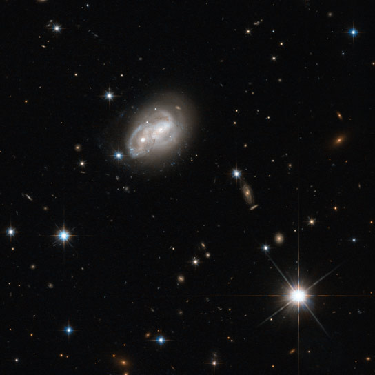 New Hubble Image Shows Two Spiral Galaxies Engaged in a Cosmic Tug of War