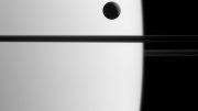 New Image of Saturn's Moon Dione Crossing the Face of Saturn