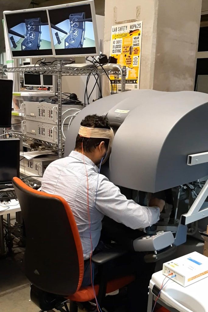 Noninvasive Brain Stimulation at Surgical Robot Console