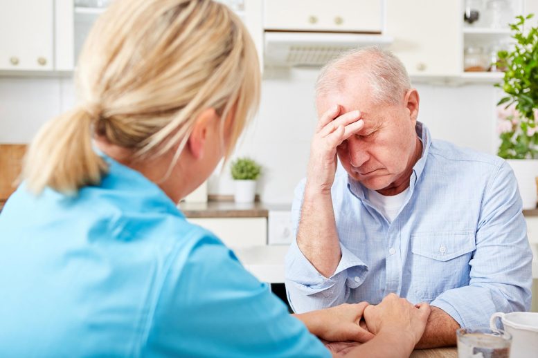 Nurses comfort elderly people with dementia