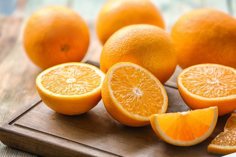 Oranges on Wood Board