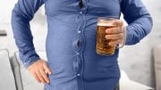 Overweight Man Drinking Beer