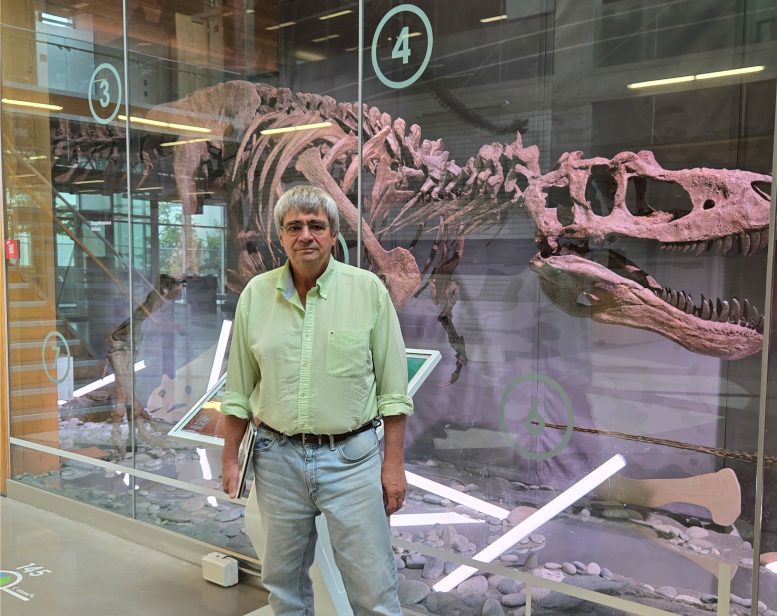 Philippe Claeys With Dinosaur Skeleton Exhibit