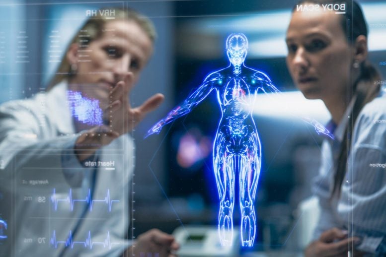 Physician And Patient Examine Holographic Body Models