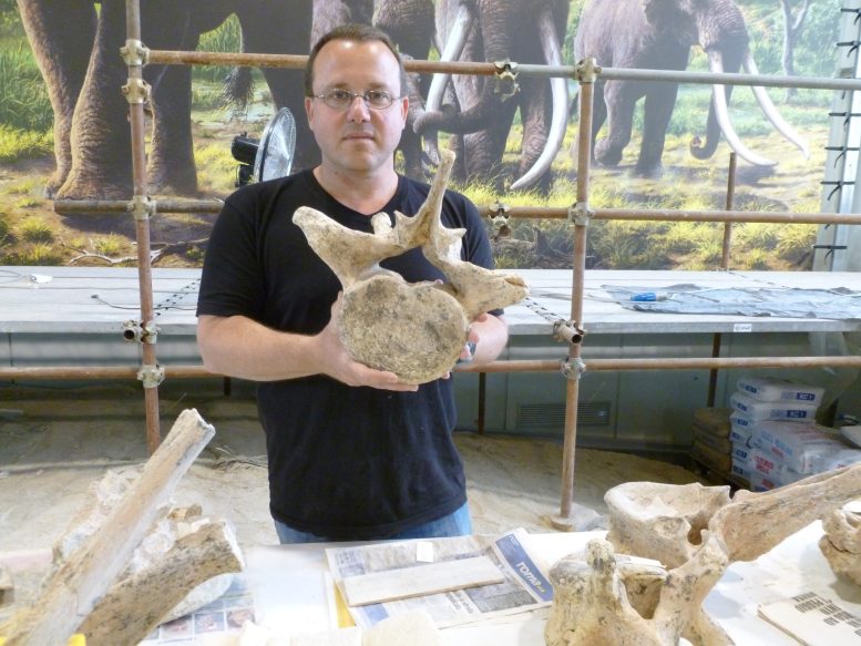 Prof Ran Barkai Holds a Segment of an Ancient Elephant