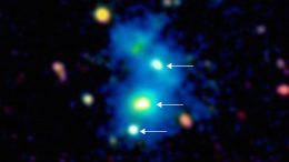 Quasar Quartet Embedded in Giant Nebula Reveals Rare Massive Structure in Distant Universe