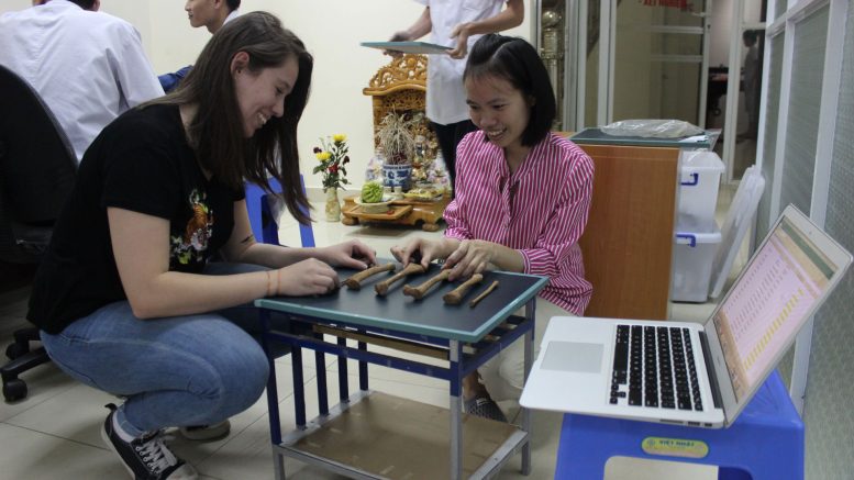 Researchers in Front of Ancient Bones