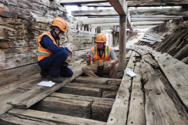 Robert Blanchette and Claudia Chemello Examine the Wood of the USS Cairo