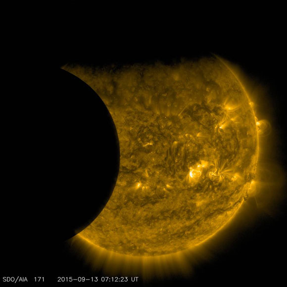 SDO Views Earth and the Moon Transiting the Sun