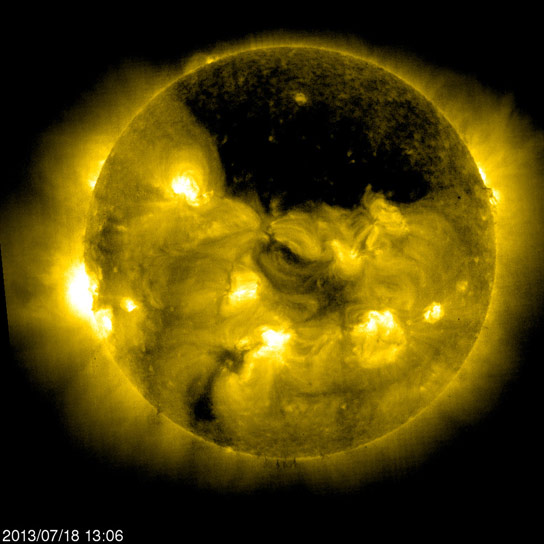 SOHO Views A Gigantic Coronal Hole Hovering Over the Suns North Pole