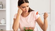 Sad Woman Eating Salad
